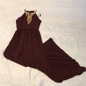Plum color gown with good necklace